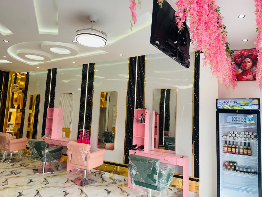 Salon interior with glam lighting and styling stations